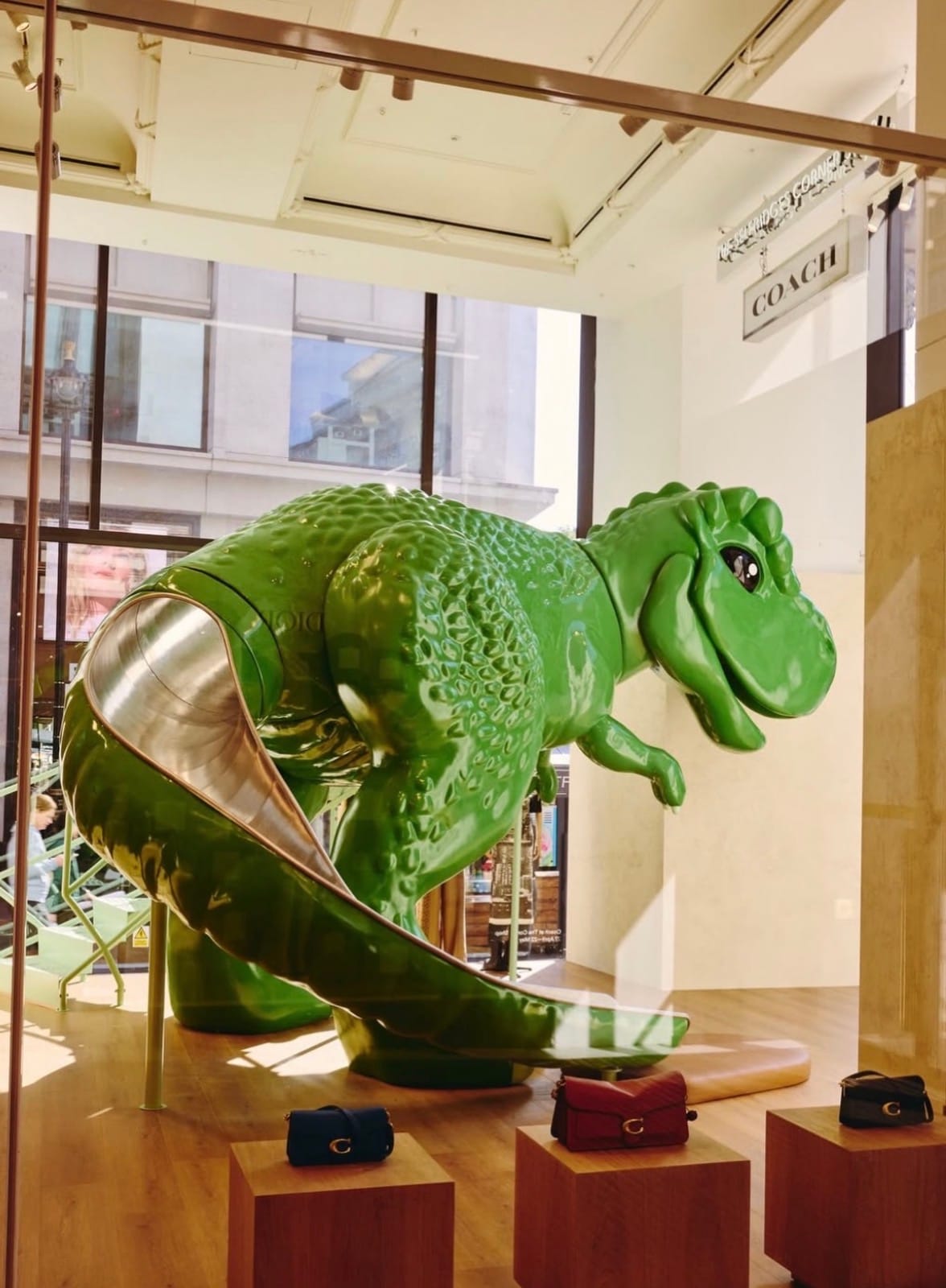 Coach Put a T-Rex Slide in Selfridges and It Makes Complete Sense
